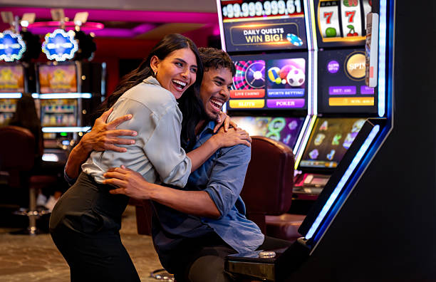 Playtech live-dealer studio broadcast showing blackjack and roulette tables